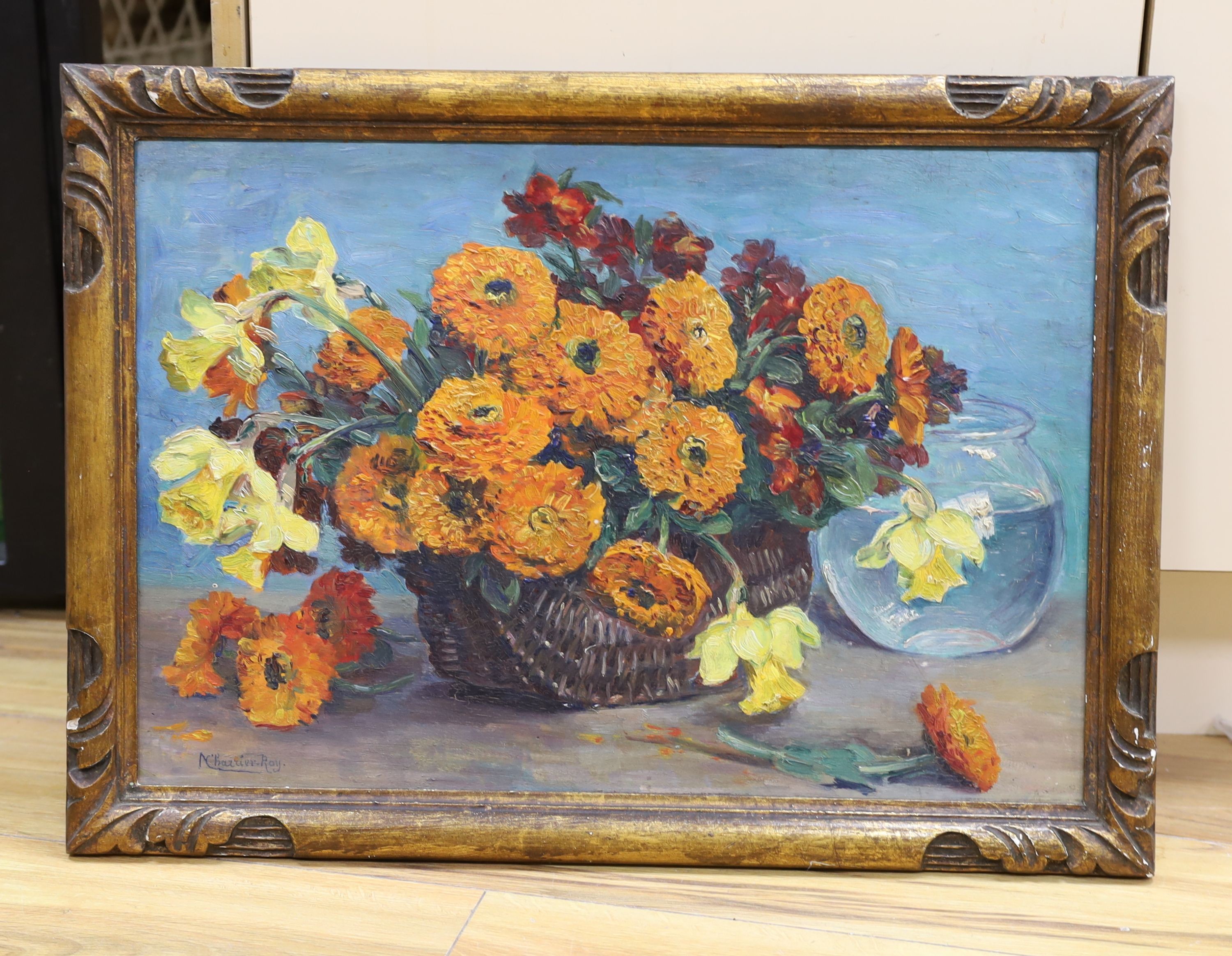 Marguerite Charrier-Roy (French 1870-1964), oil on panel, Still life of Marigolds and Daffodils in a basket, signed, 37 x 53cm